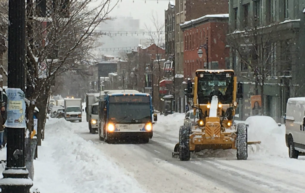 Bus and snow plow on St. Lawrence Blvd.