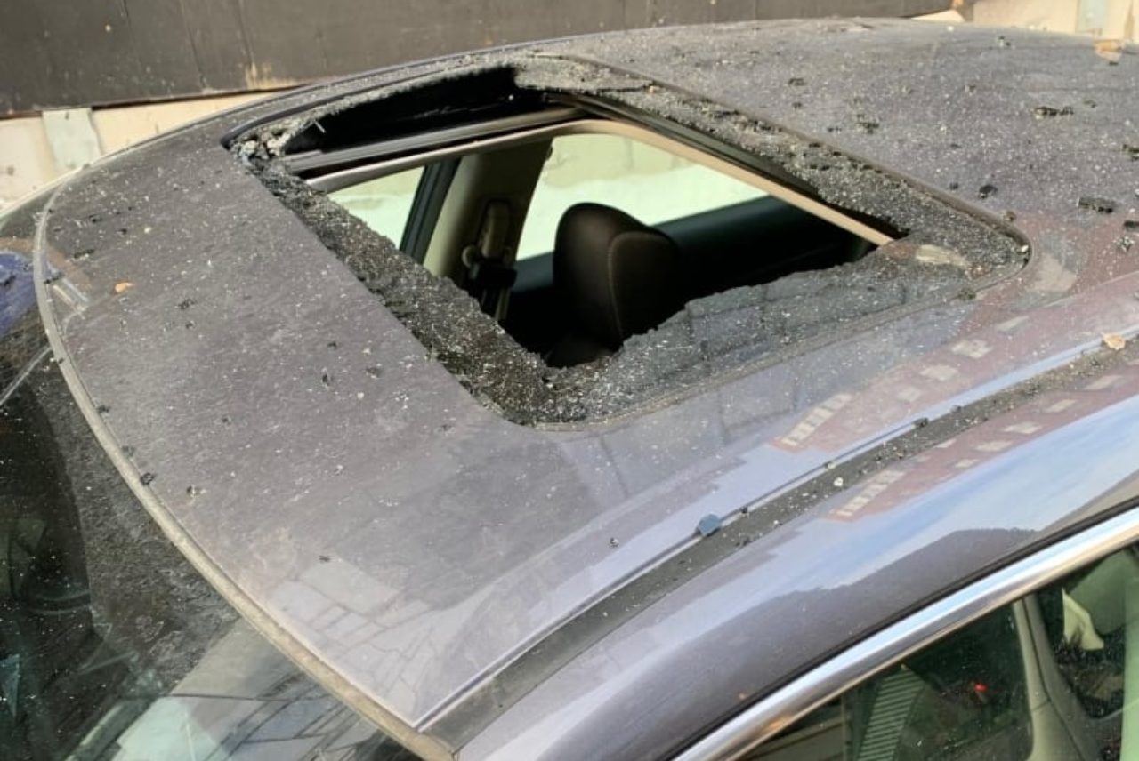 falling-ice-car-damages-sunroof
