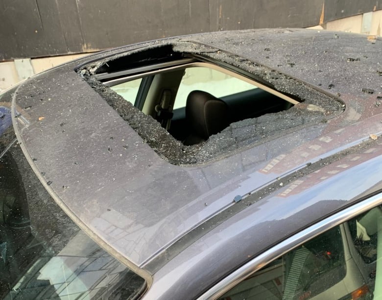 falling-ice-car-damages-sunroof