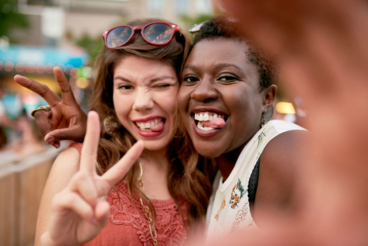 two girls taking selfies photos