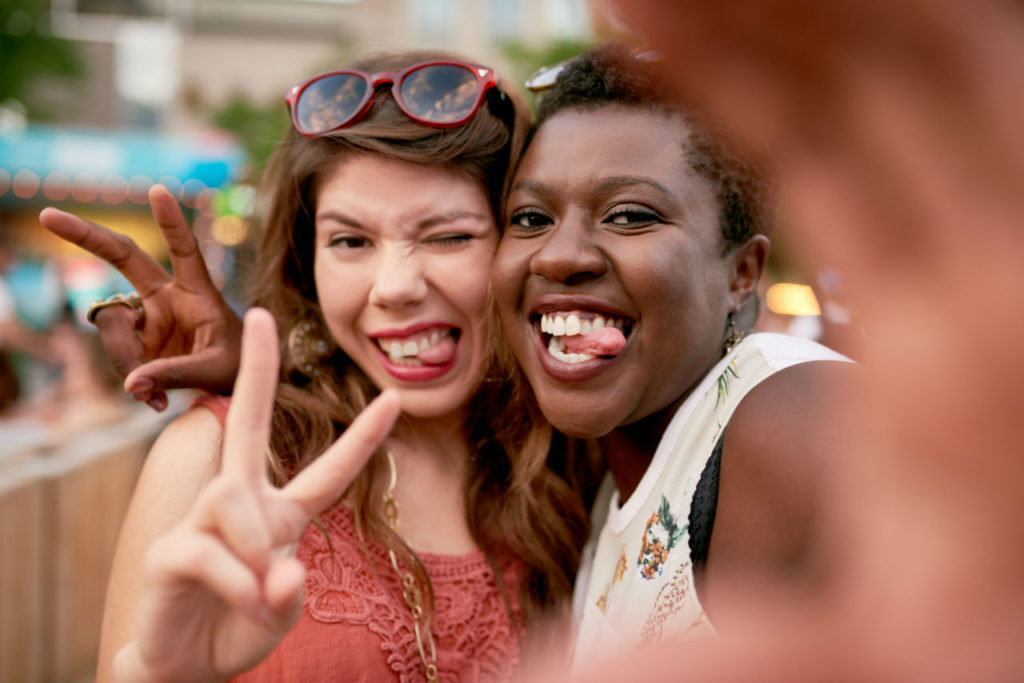 two girls taking selfies photos