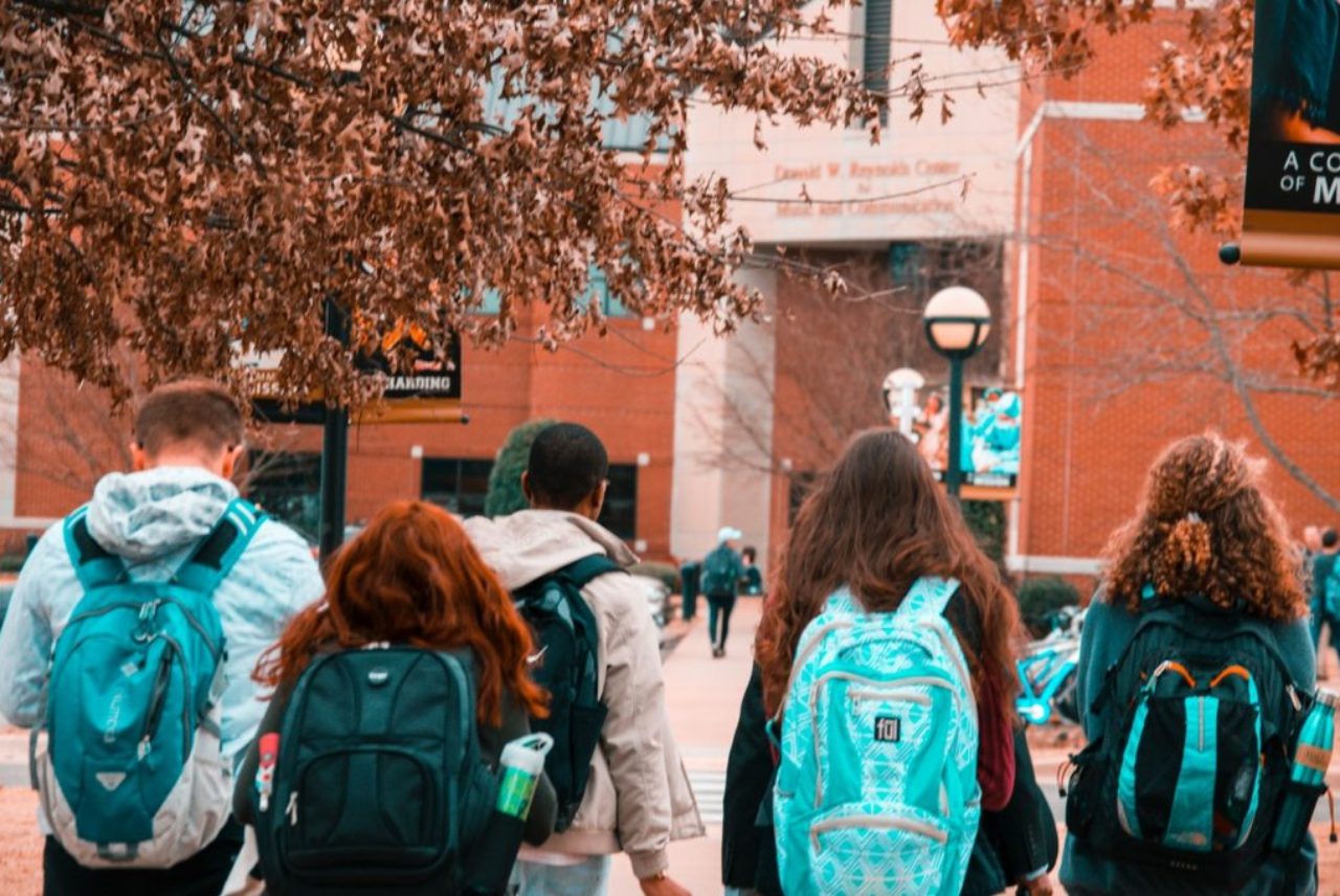 five-young-people-wearing-backpacks